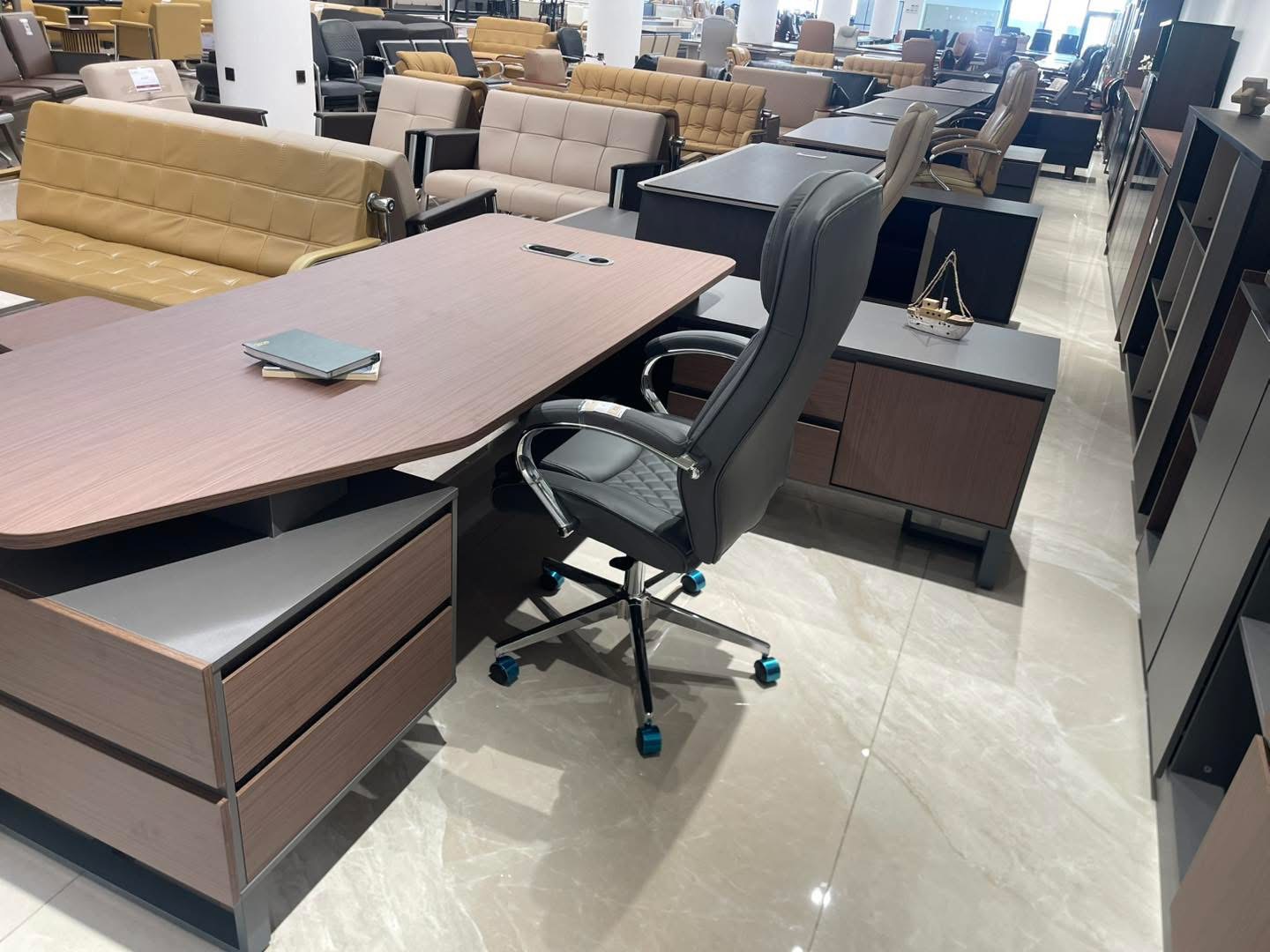 Customer showroom proof with executive desks, meeting tables and storage combinations