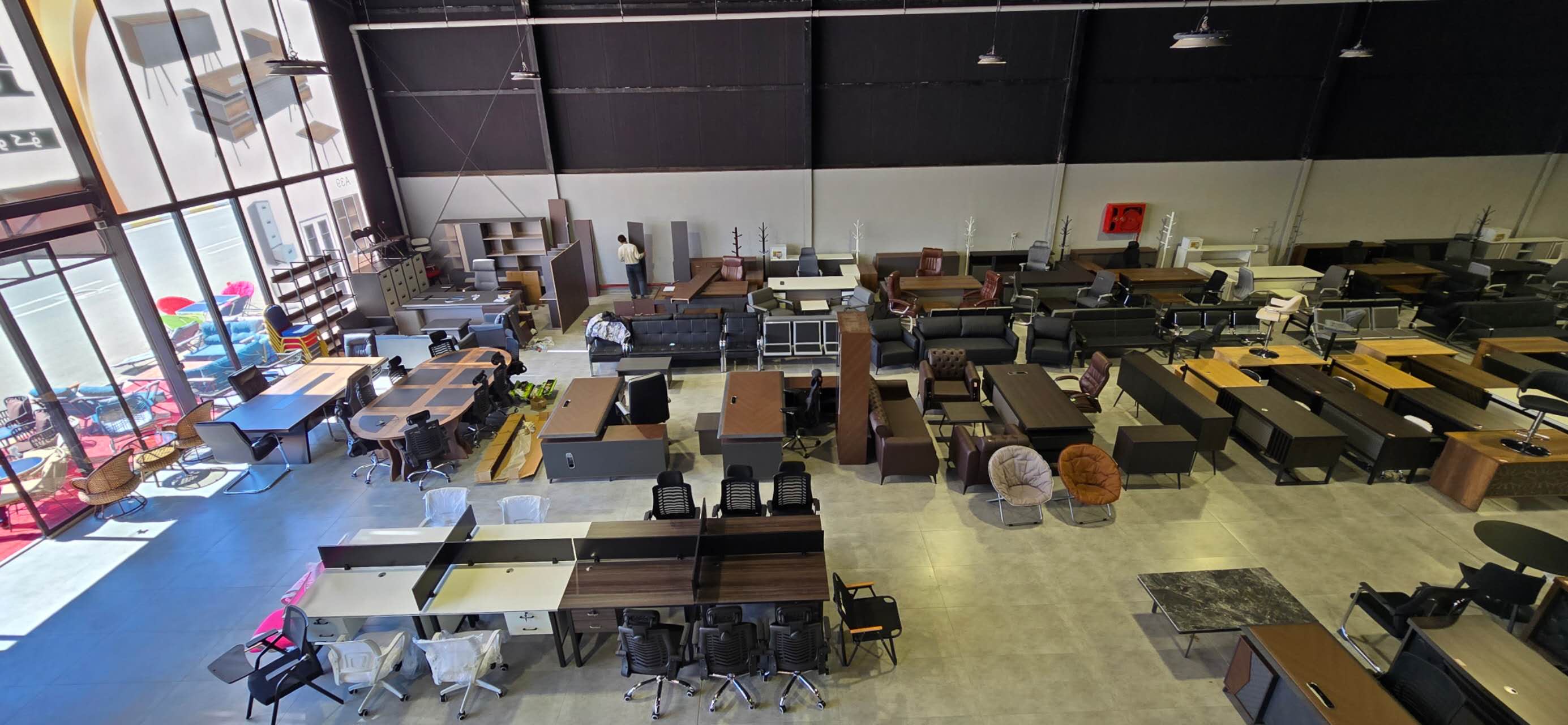 Turkmenistan buyer showroom-floor reference with office desks, storage and display mix