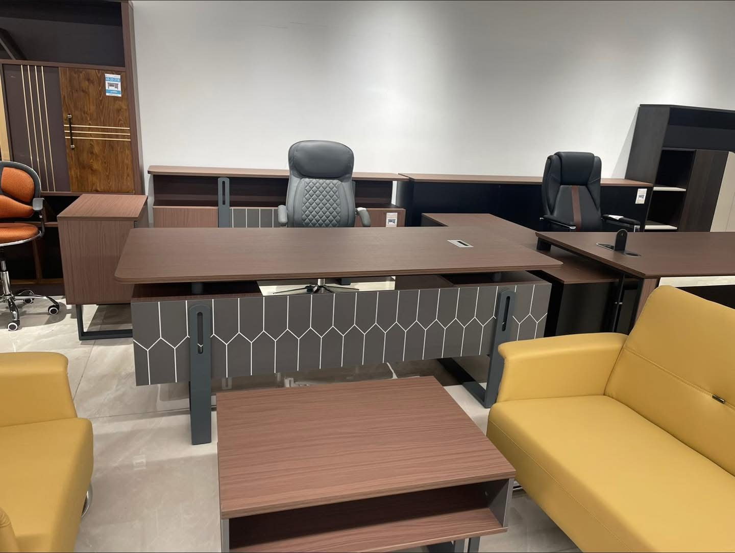 Cameroon buyer showroom-floor reference with office desks, storage and display mix