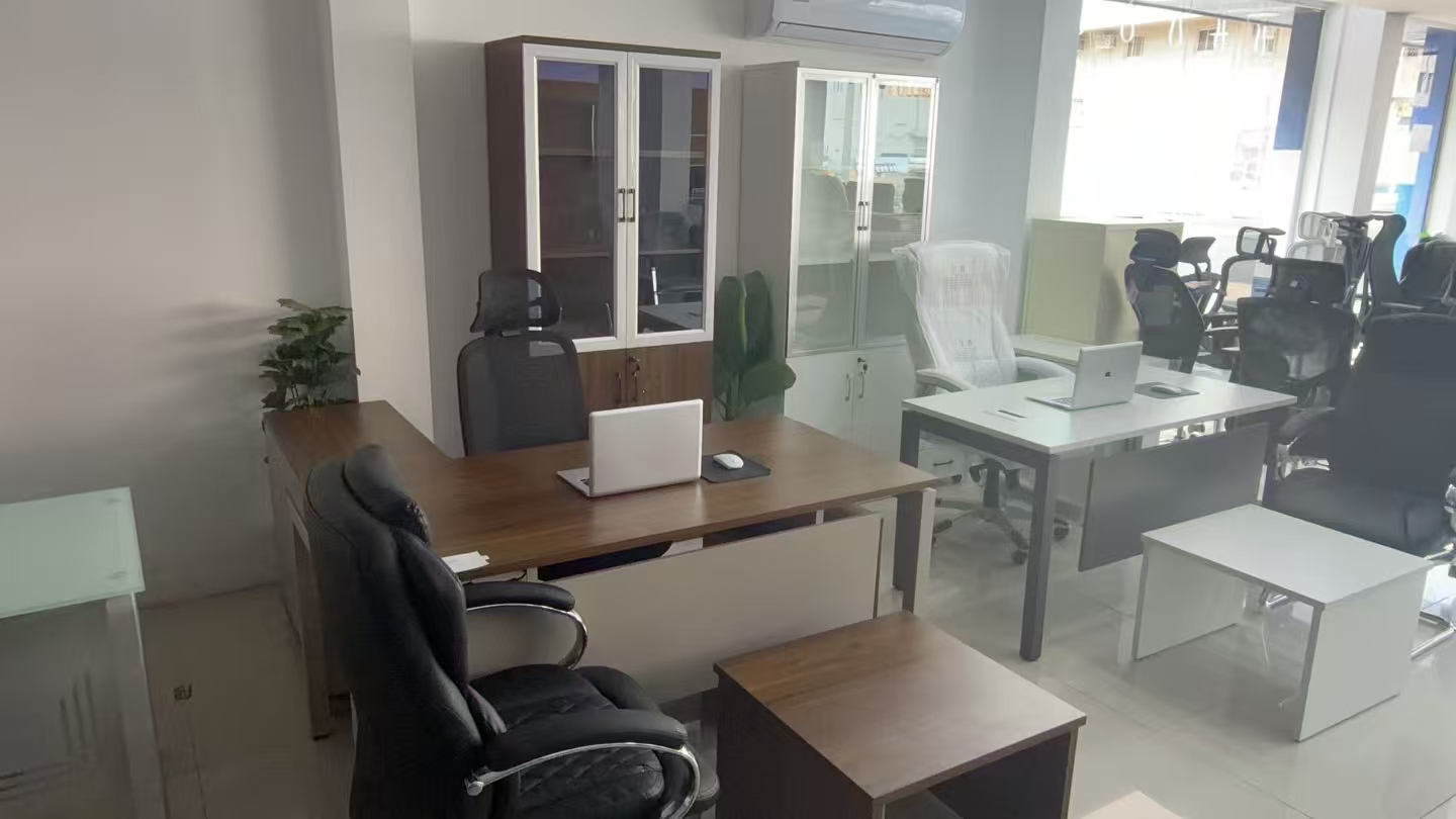 Mozambique buyer showroom-floor reference with office desks, storage and display mix